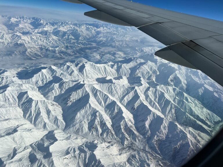 The Himalayan range seen from the window of the Kathmandu to Paro flight — the 90-minute connection between Nepal and Bhutan