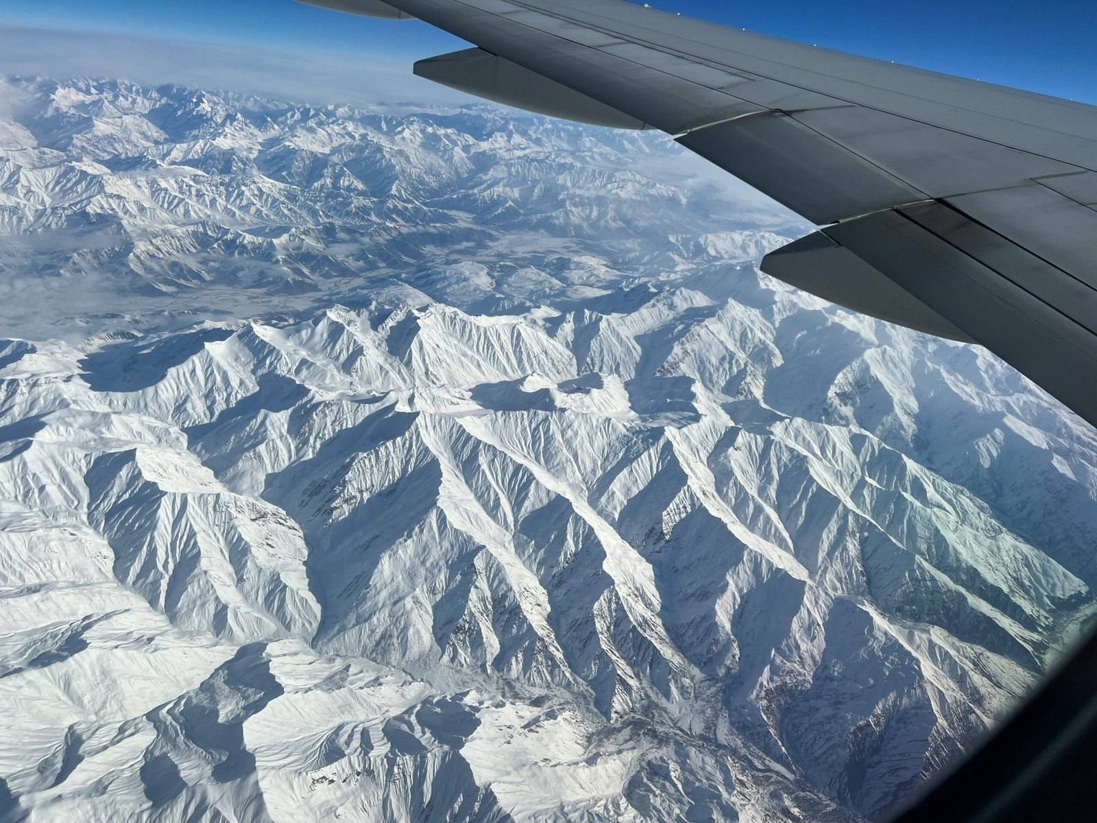 The Himalayan range seen from the window of the Kathmandu to Paro flight — the 90-minute connection between Nepal and Bhutan