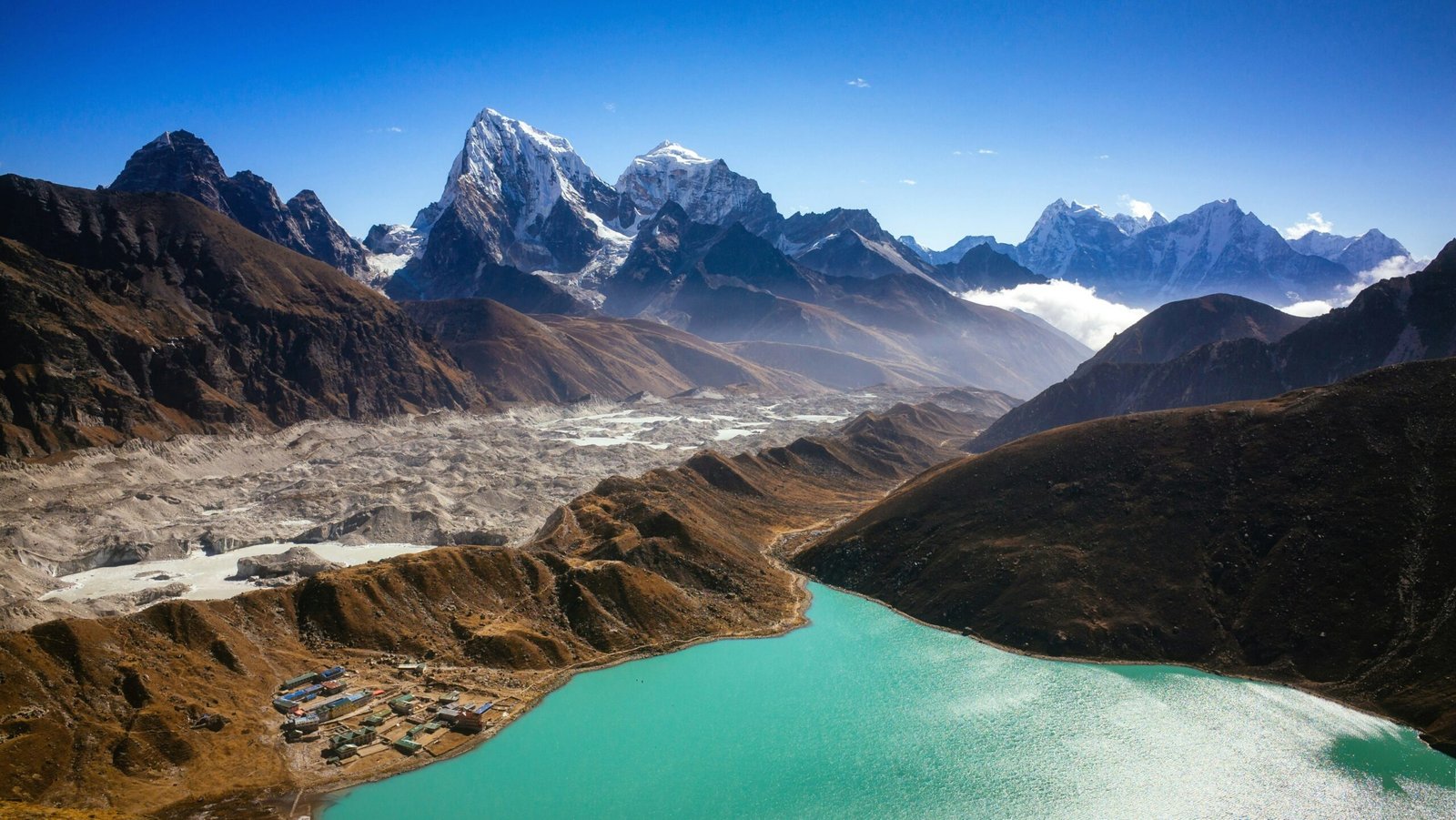 The third Gokyo Lake at 4,700 metres with snow-capped Himalayan peaks reflected in the turquoise water — a highlight of the EBC Gokyo route