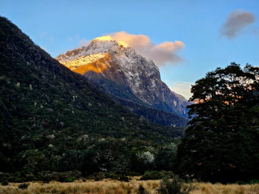 Snow-capped mountain at golden hour above Iris Burn on the Kepler Track, Fiordland