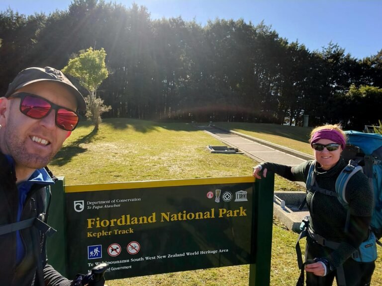 Andrew and Elaine at the Kepler Track Fiordland National Park sign at the Control Gates, Lake Te Anau