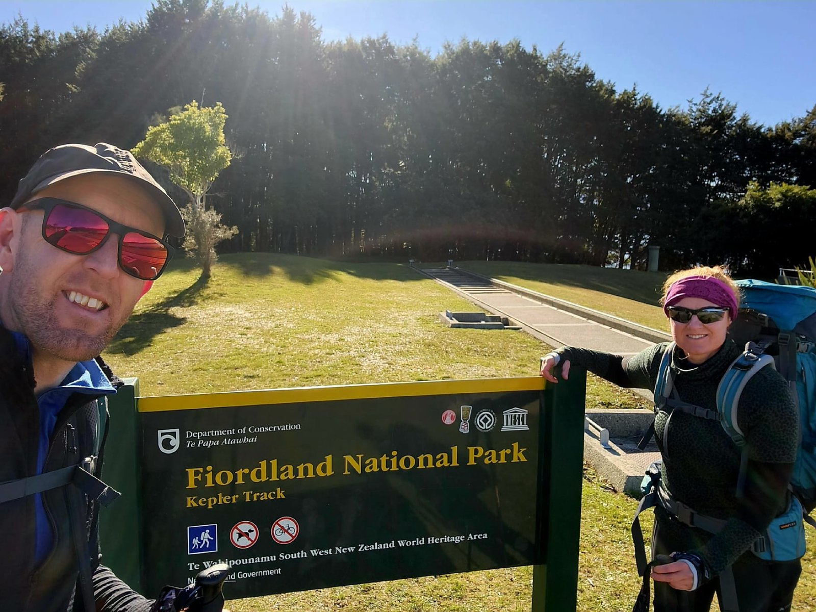 Andrew and Elaine at the Kepler Track Fiordland National Park sign at the Control Gates, Lake Te Anau