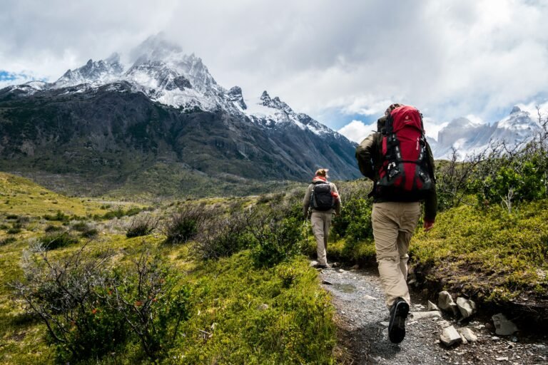 Two trekkers on a mountain trail — the case for trekking Everest Base Camp solo or with a partner