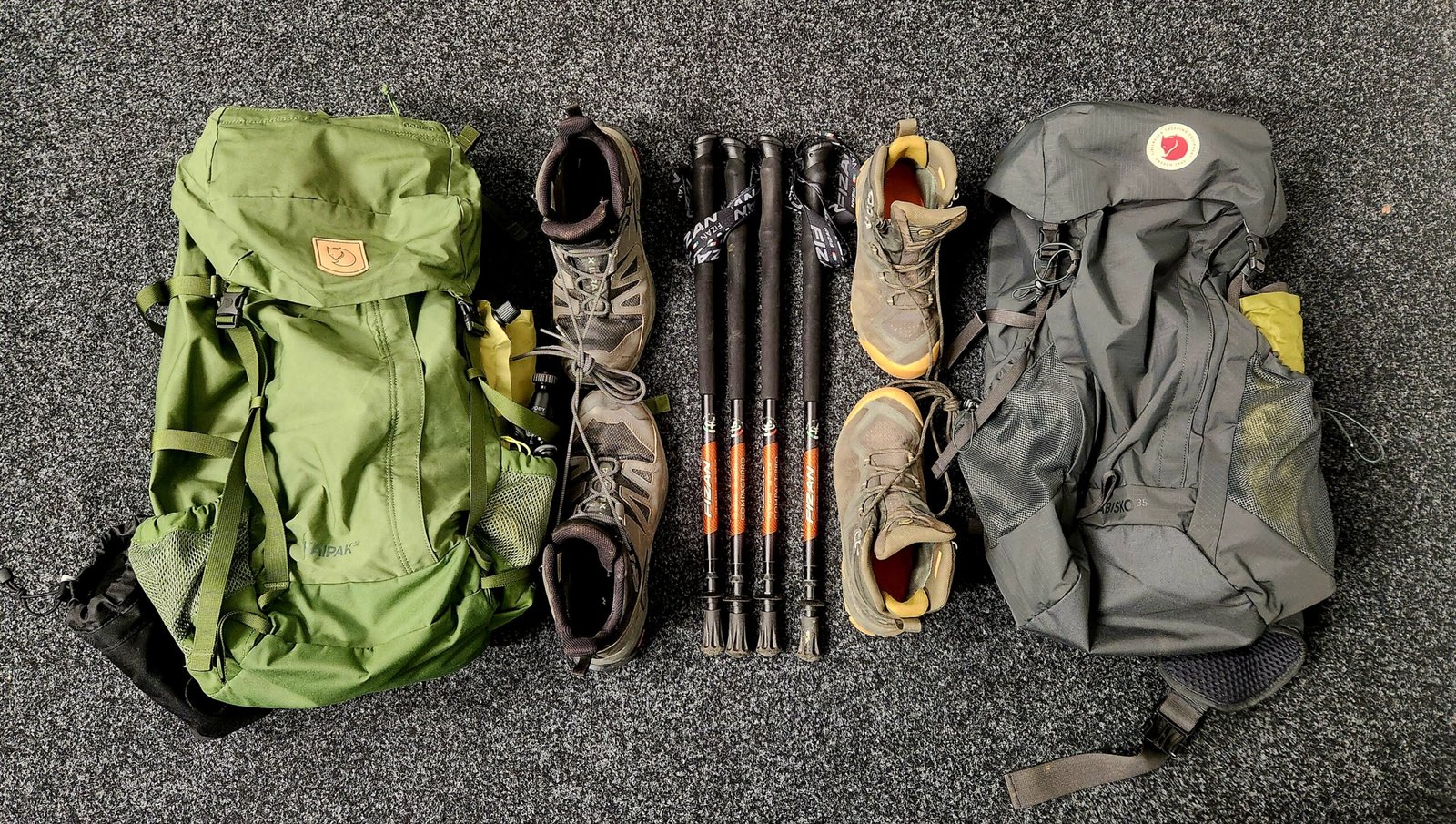 Packed gear ready for EBC departure — Fjällräven daypacks, Salomon/Mammut boots, Fizan poles laid out before leaving Auckland